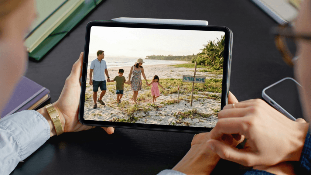 Happy Filipino family standing on an undeveloped beachfront lot, representing long-term property investment and homeownership for OFWs