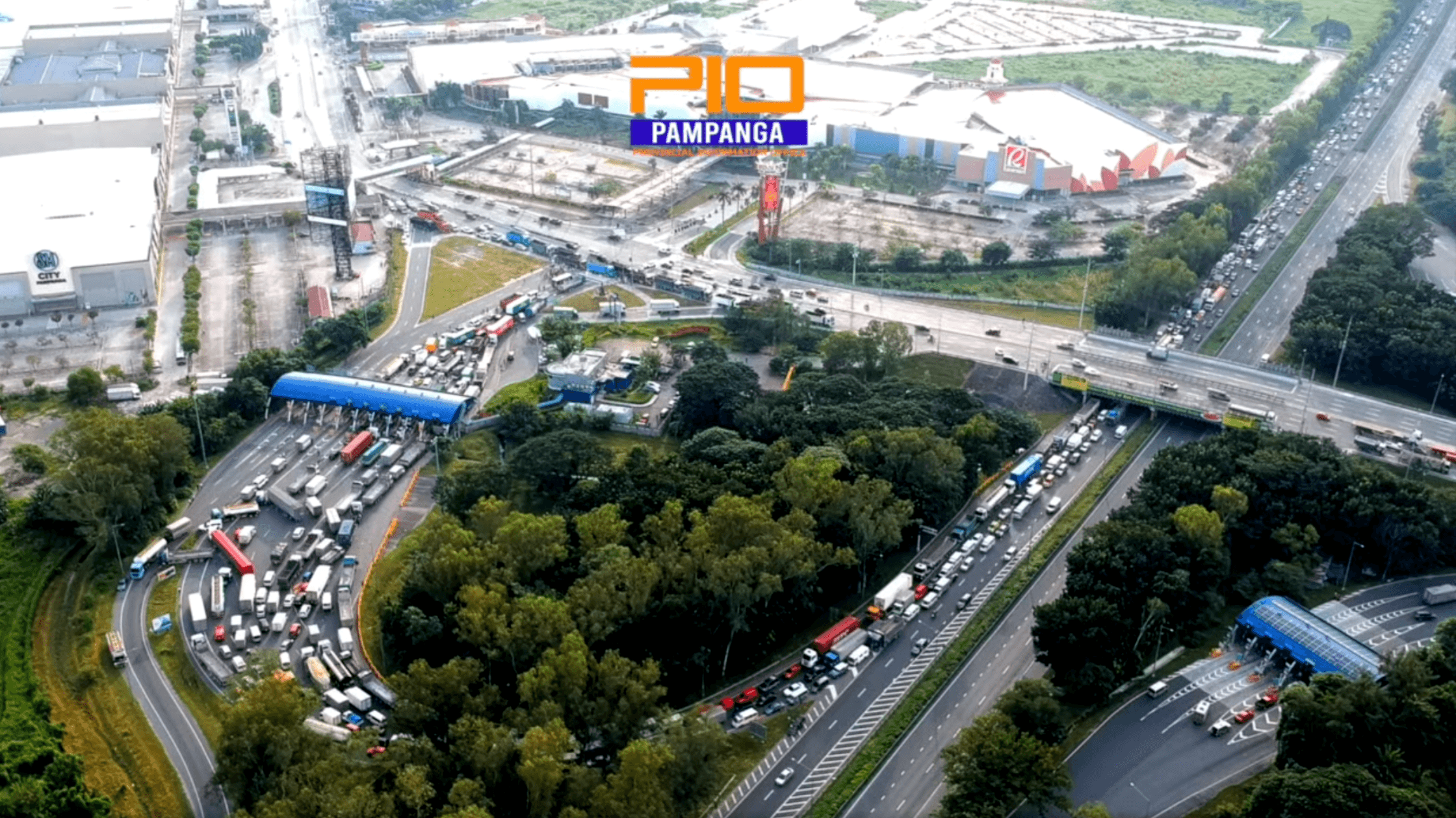 Aerial view of traffic and commercial area in Pampanga along a major expressway intersection.